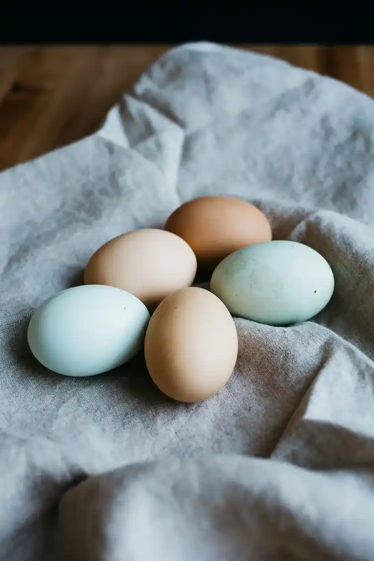 Peeled six-minute egg with perfectly set white and liquid gold center running onto toast